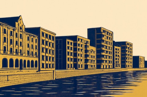 Backsteinlagerhäuser und Neubauwohnungen an Bremens Überseestadt-Ufer